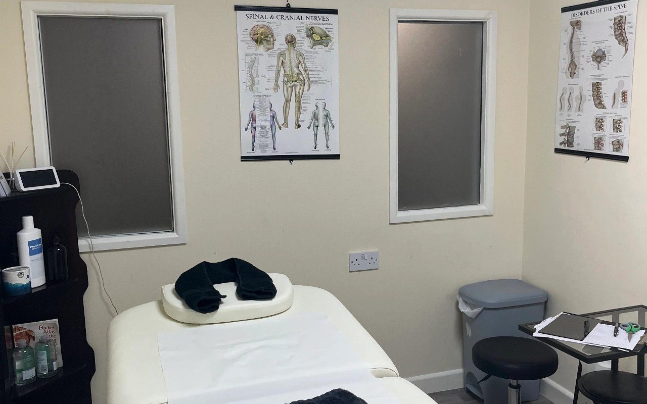Treatment couch, anatomy charts and equipment